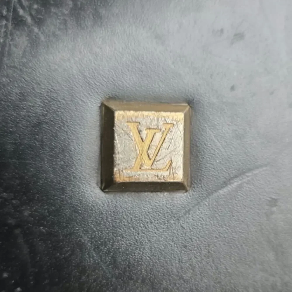 Black leather Louis Vuitton locKit bag